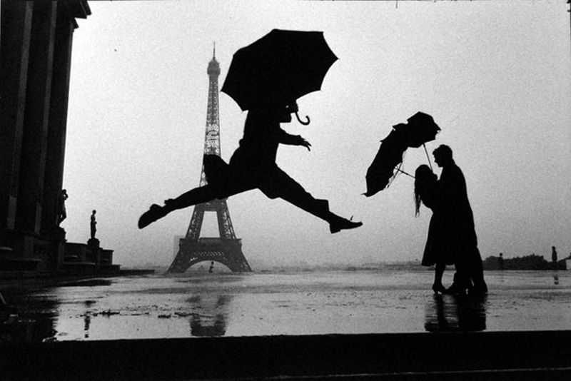 Elliott Erwitt Paris, France (Man Jumping with Umbrella)