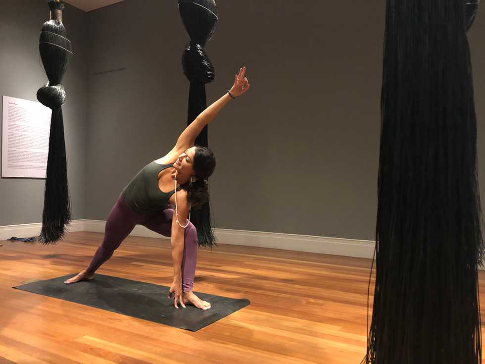 Instructor-performing-yoga-at-the-Ogden-Museum-of-Southern-Art.jpg